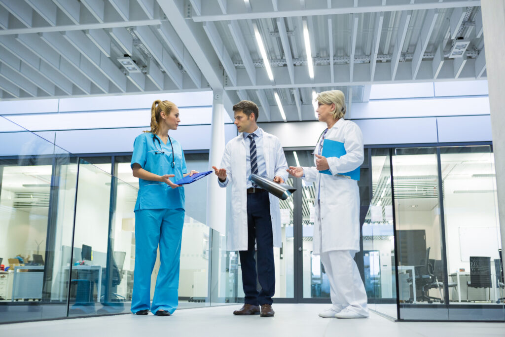 medical team interacting with each other corridor